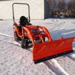 Kubota BX snow plow attachment. Kubota BX Quick attach loader mounted snow plow attachment